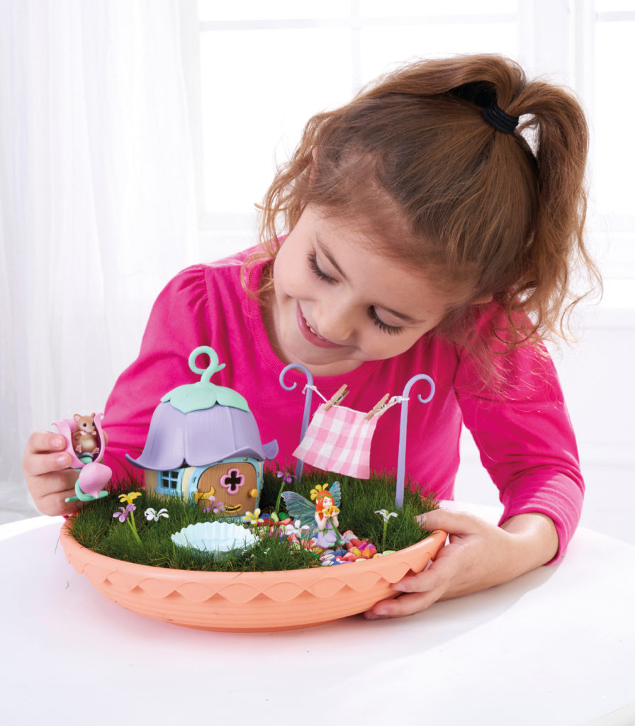 girl playing with my fairy garden toy from brightminds